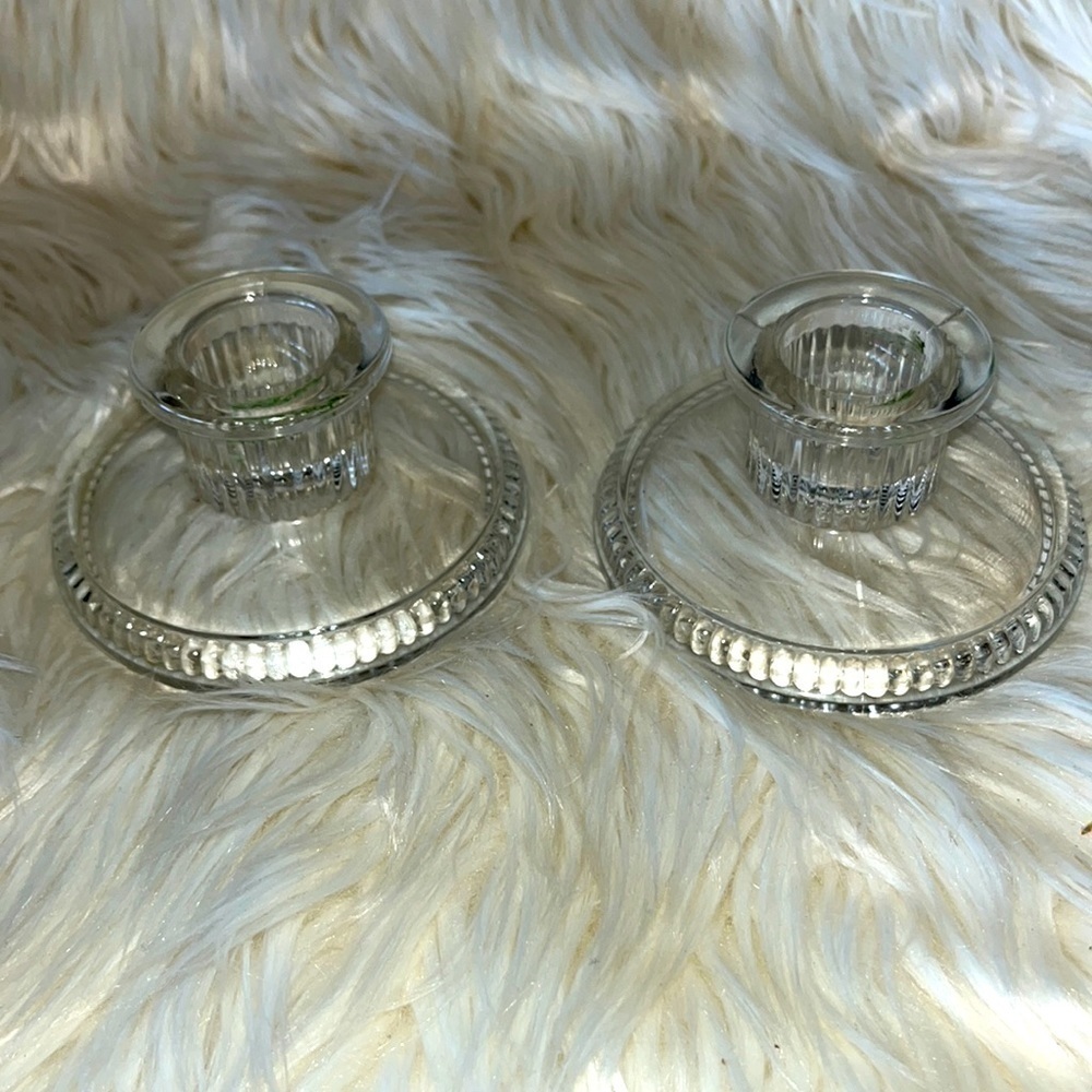 Set of 2 clear glass candleholders.